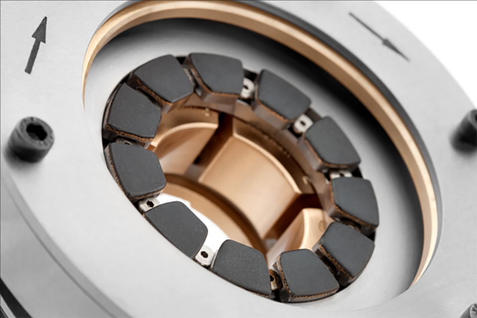 Combination tilt pad bearing with solid bronze journal pads and polymer-lined thrust pads